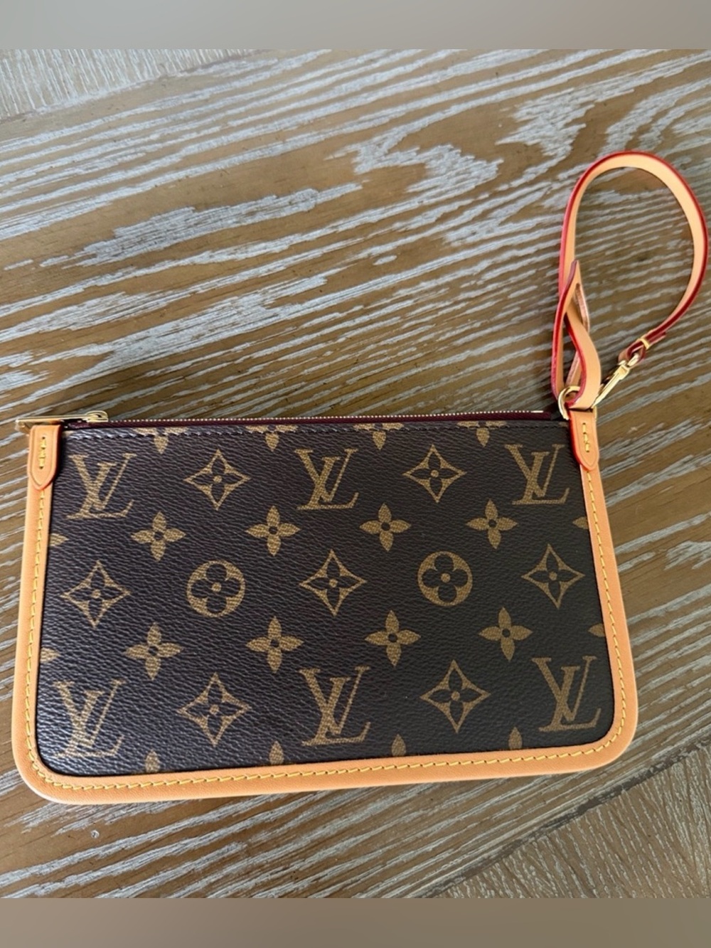 Louis Vuitton Neverfull Clutch